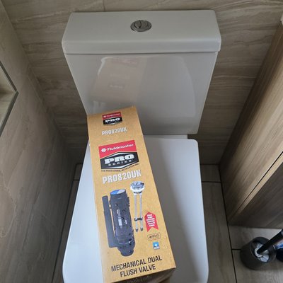 Toilet repaired with new flush valve